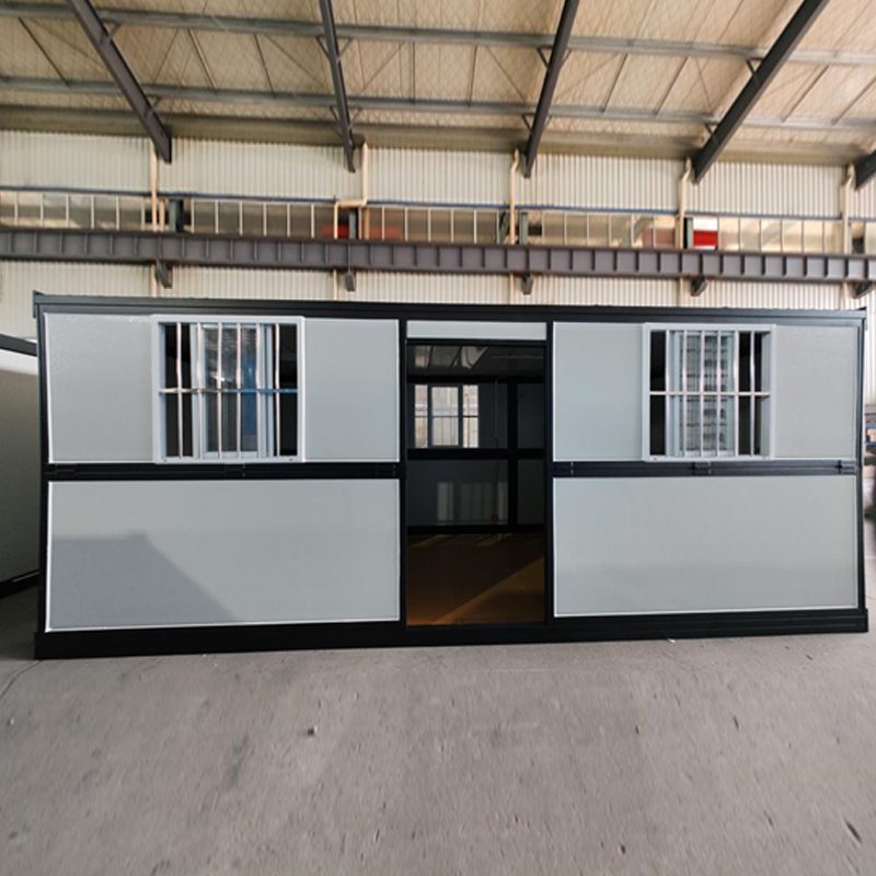 Black-frame folding cabin with side door and twin windows
